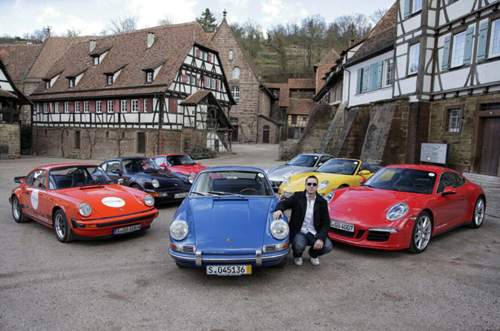 MOTOR-TALK-Reporter Contantin Bergander mit allen 911-Generationen.