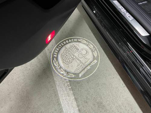 DMP AMG Logo Projektor (Tag)