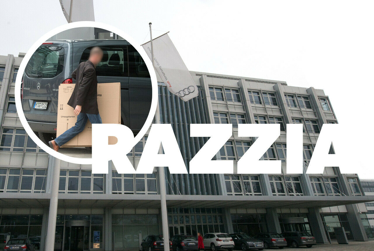 Ein Ermittler trägt im Rahmen der Audi-Razzia einen Karton in das Gebäude der Firmenzenntrale von Audi in Ingolstadt