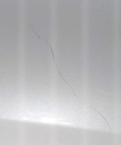 Schaden Tuerhintenlinks oben ohne Lack