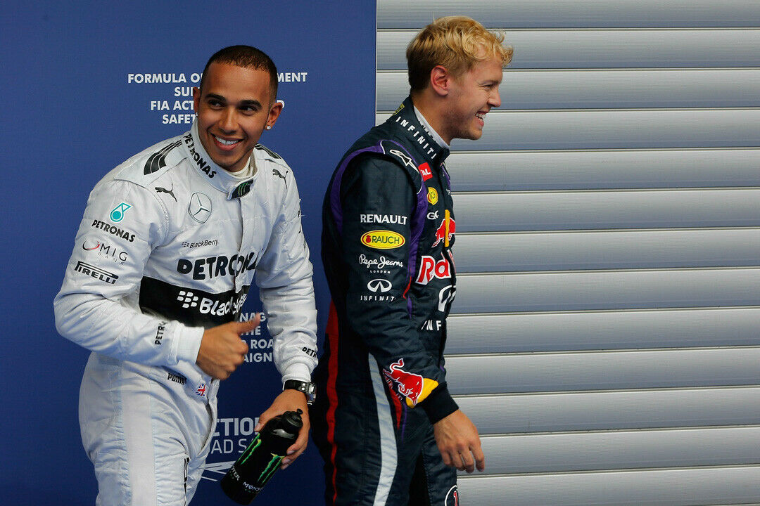 British Formula One driver Lewis Hamilton of Mercedes AMG (L) and German Formula One driver Sebastian Vettel of Red Bull Racing (R) after the qualifying session at the Spa-Francorchamps race track near Francorchamps, Belgium, 24 August 20