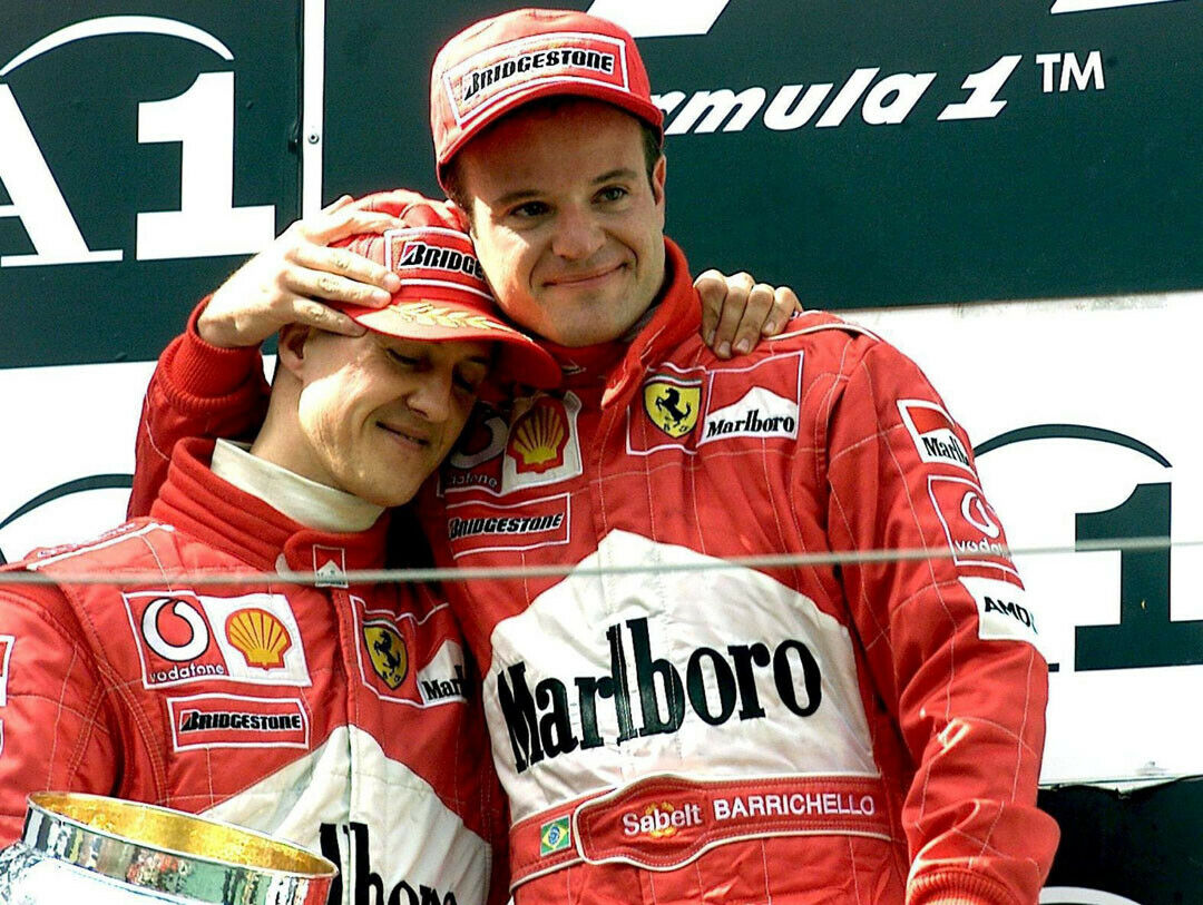 Michael Schumacher und sein Teamkollege Rubens Barrichello nachdem sie am 12. Mai 2002 den ersten und zweiten Platz beim Austrian Grand Prix in Spielberg belegten