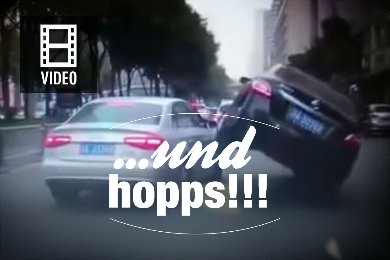 Ein Nissan Teana fährt über einen Audi